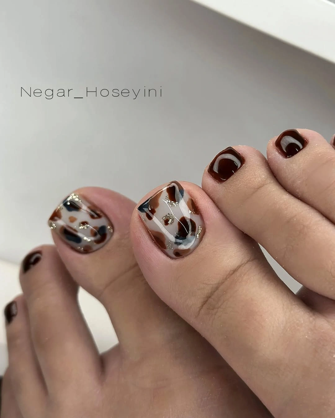 Fall pedicure ideas 2026 Elegant Tortoiseshell Pedicure With Glossy Mocha Accents