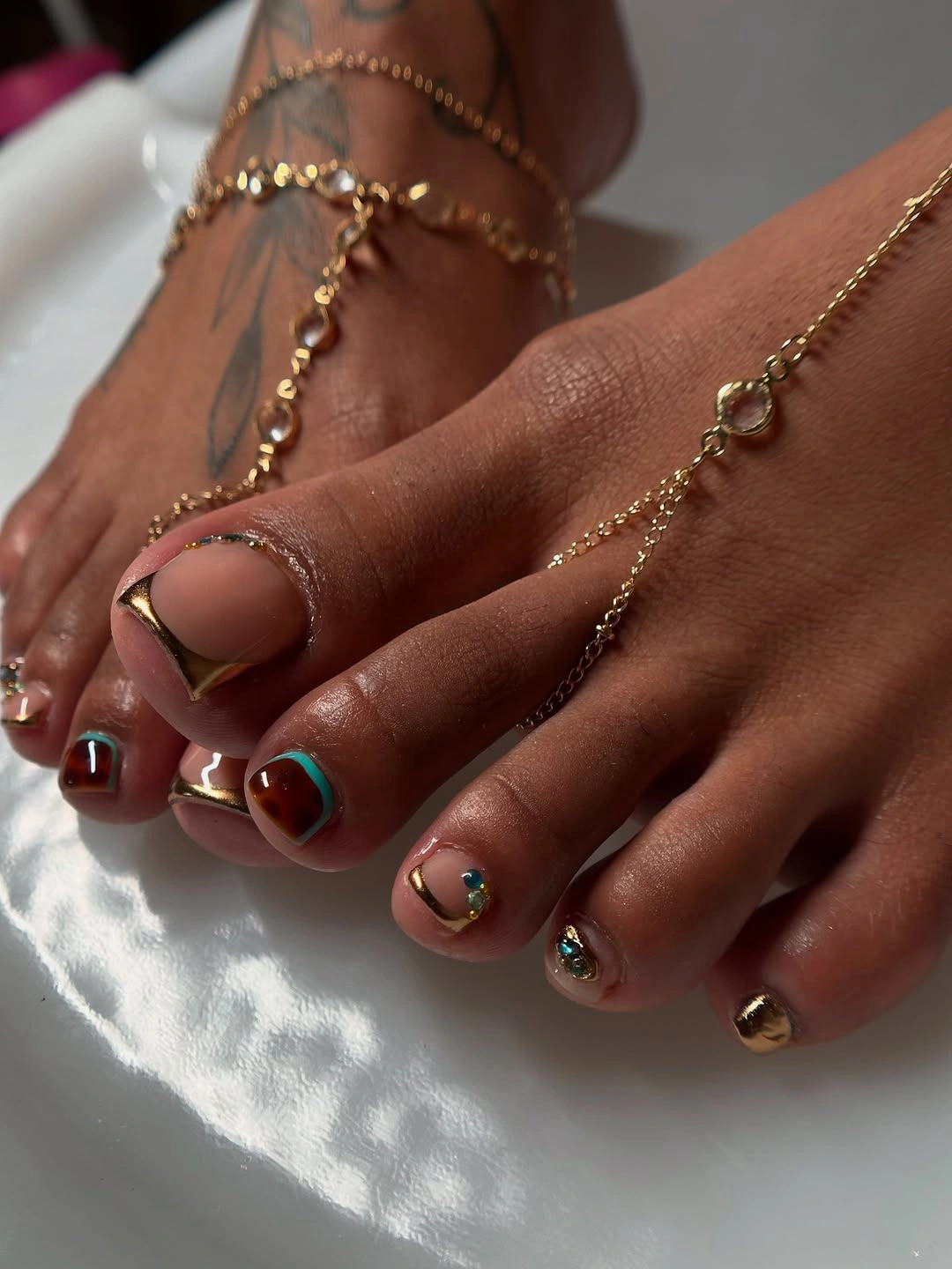 Fall pedicure ideas 2026 Gold Chrome Accents With Modern Jewel Details