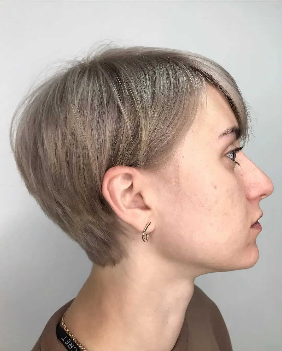 fall pixie haircut ideas 2026 Soft Mushroom Blonde Pixie With Feathered Layers