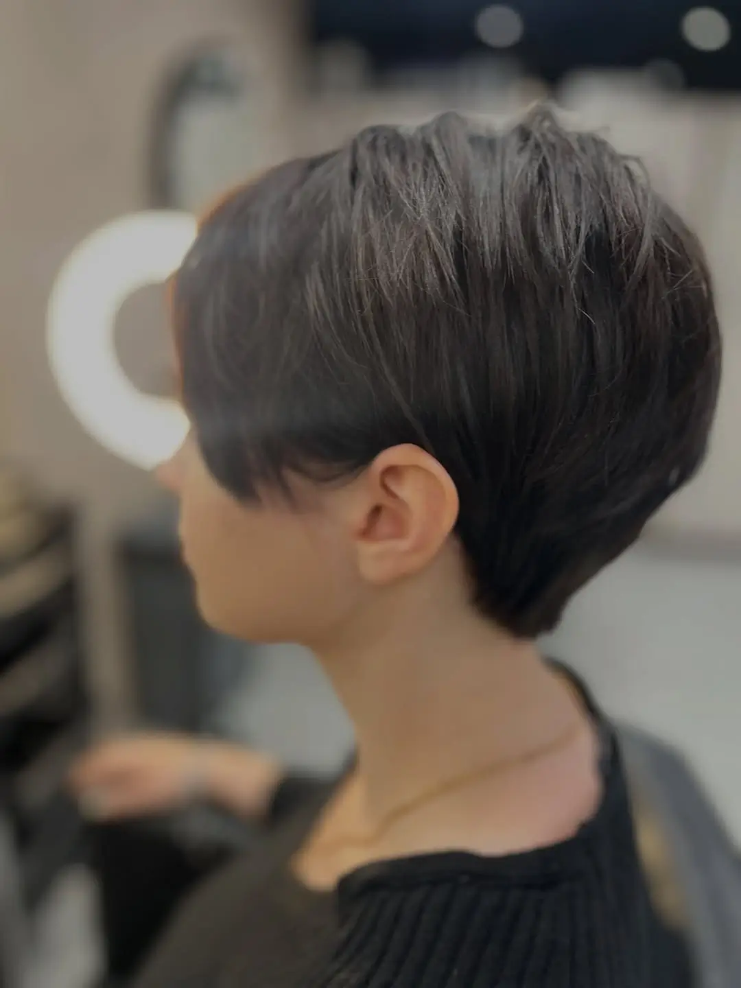 fall pixie haircut ideas 2026 Sleek Espresso Pixie With Long Side Fringe