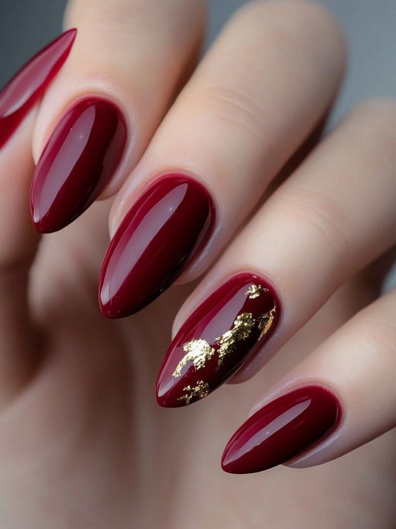Fall red nails 2026 Burgundy Almond Nails With Luxurious Gold Foil