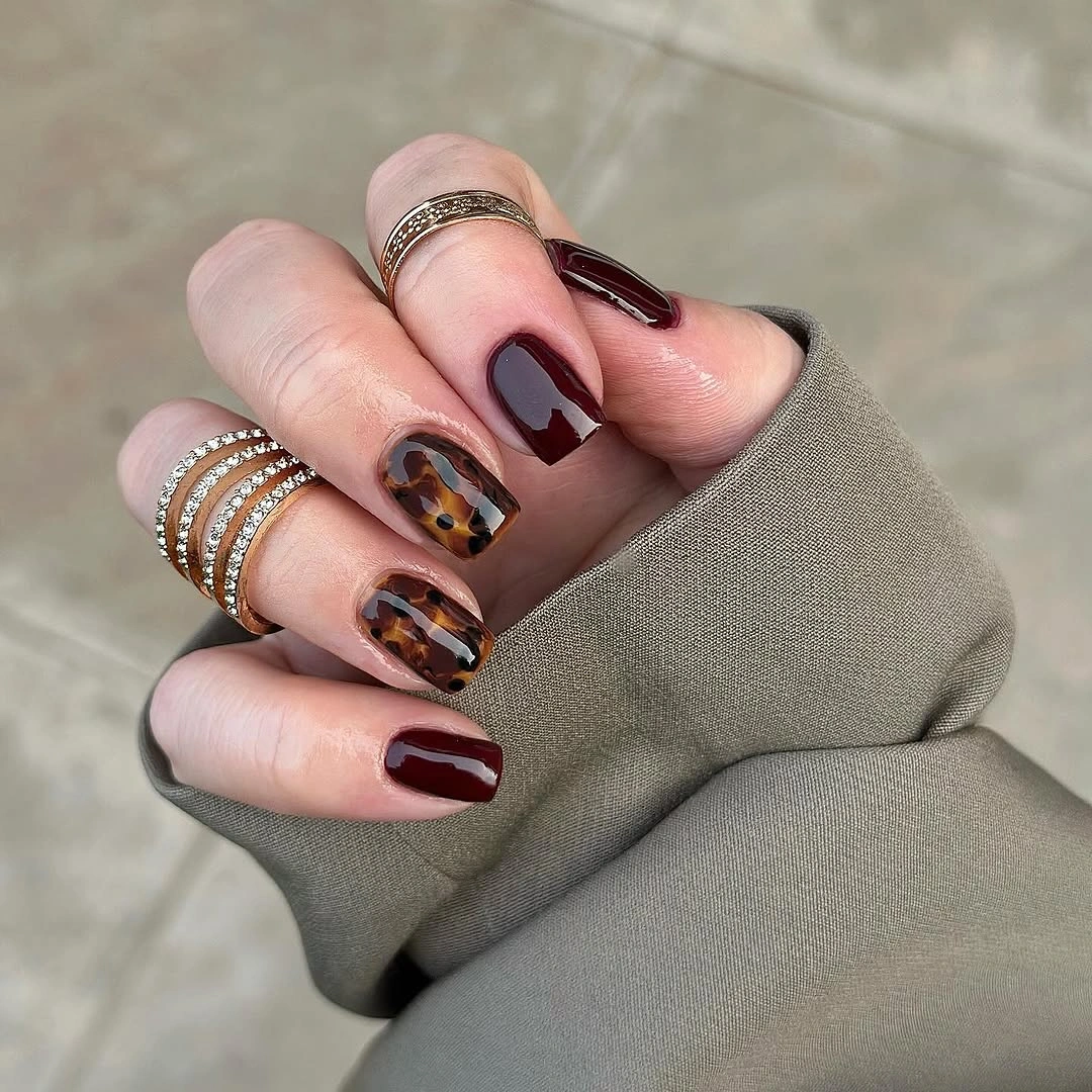 Fall red nails 2026 Burgundy and Tortoiseshell Nails for Chic Fall Fashion