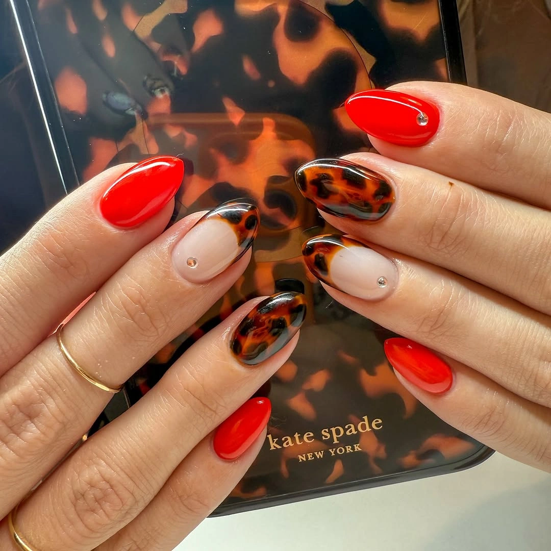 Fall red nails 2026 Bright Scarlet and Tortoiseshell Accent Nails