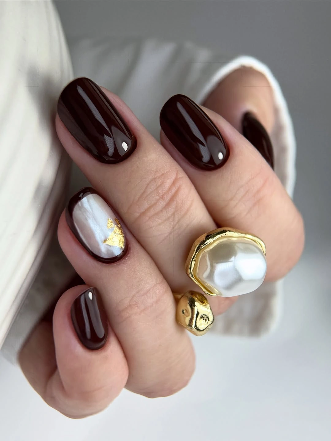 Fall red nails 2026 Deep Chocolate Red Nails With Pearl Accent