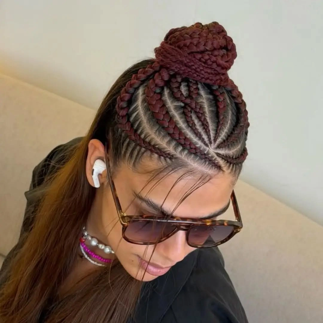 feed in braid hairstyles Feed In Braids with a Sculpted High Bun