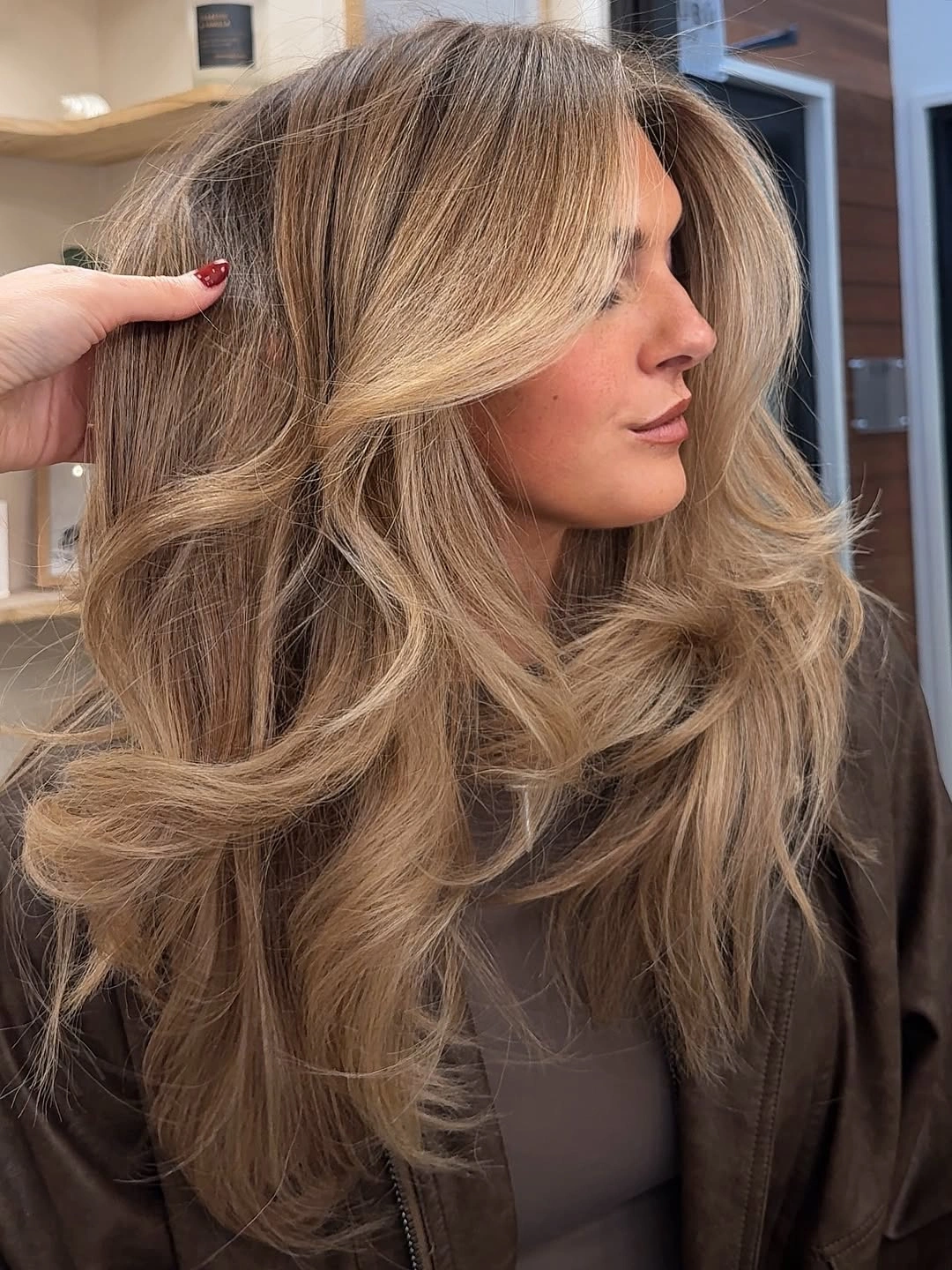 full head babylights blonde on brown hair Voluminous Champagne Layers With Soft Luxe Movement
