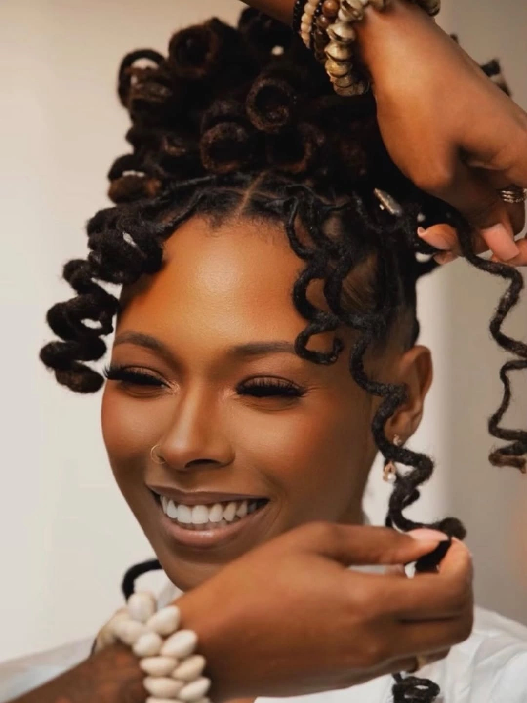 locs hairstyles for black women Playful Curled Loc Updo With Soft Spiral Ends