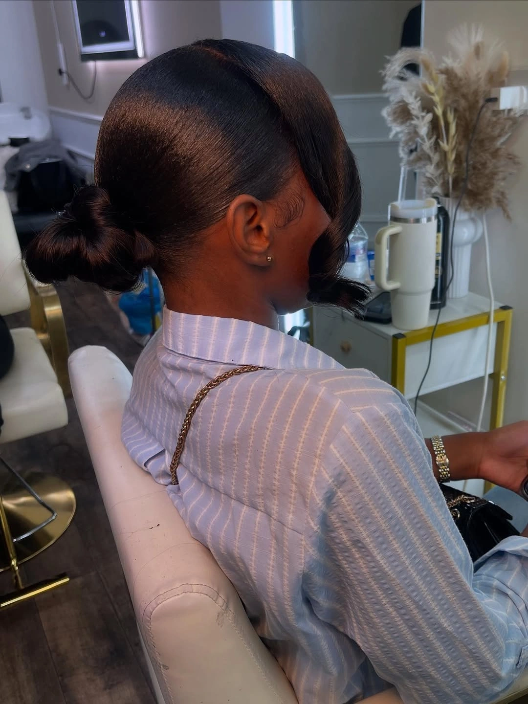 September hairstyles ideas 2026 Sleek Sculpted Low Bun with a Modern Side Sweep