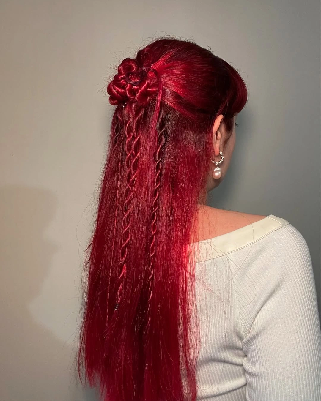 September hairstyles ideas 2026 Creative Ruby Red Half-Up Style with Accent Braids