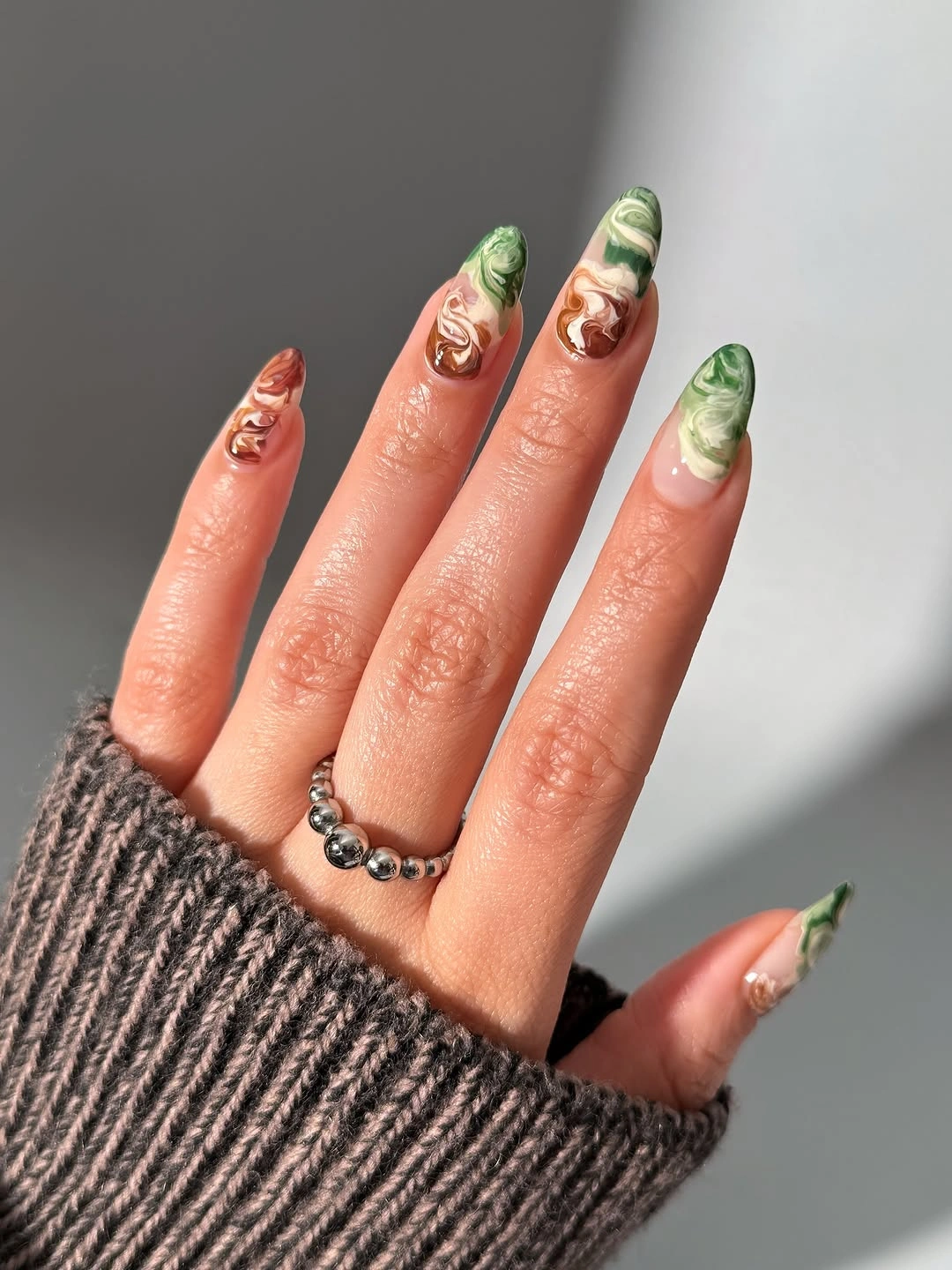 September Nail Art Ideas 2026 Earthy Marble Swirls Inspired by Forest Colors