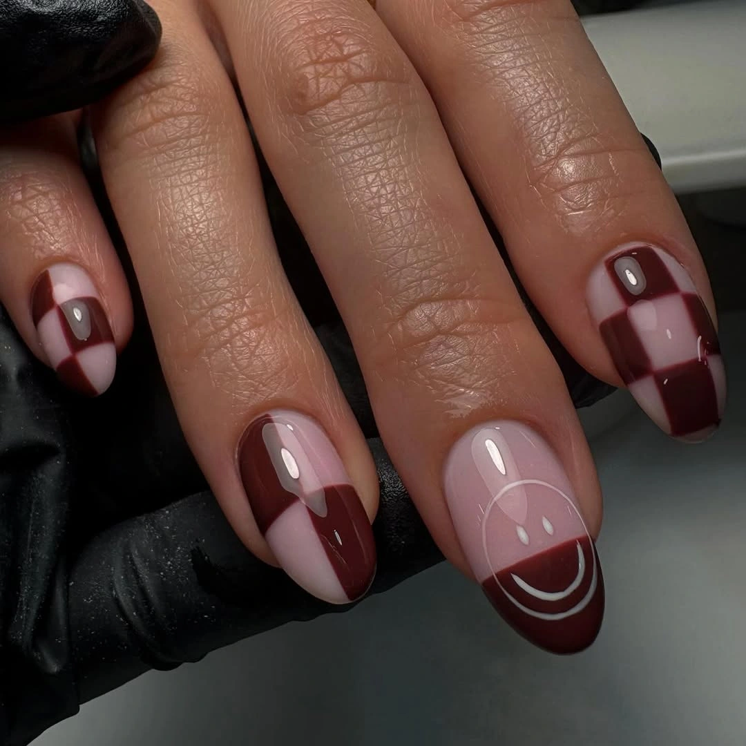 September Nail Art Ideas 2026 Chocolate Checkerboard Nails with a Playful Smile Accent