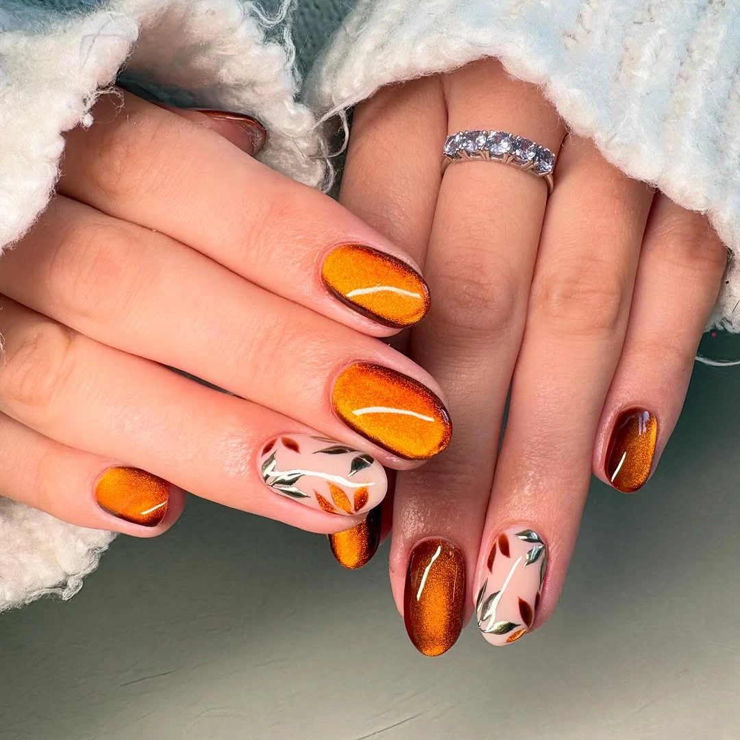 September Nail Art Ideas 2026 Burnished Copper Chrome Nails with Elegant Leaf Accents