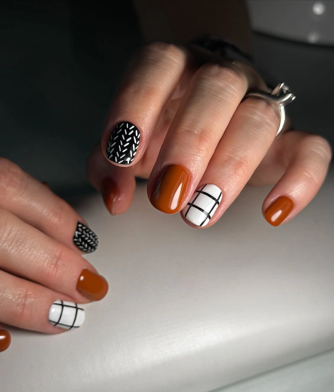 September Nail Art Ideas 2026 Modern Graphic Nails in Cinnamon and Monochrome