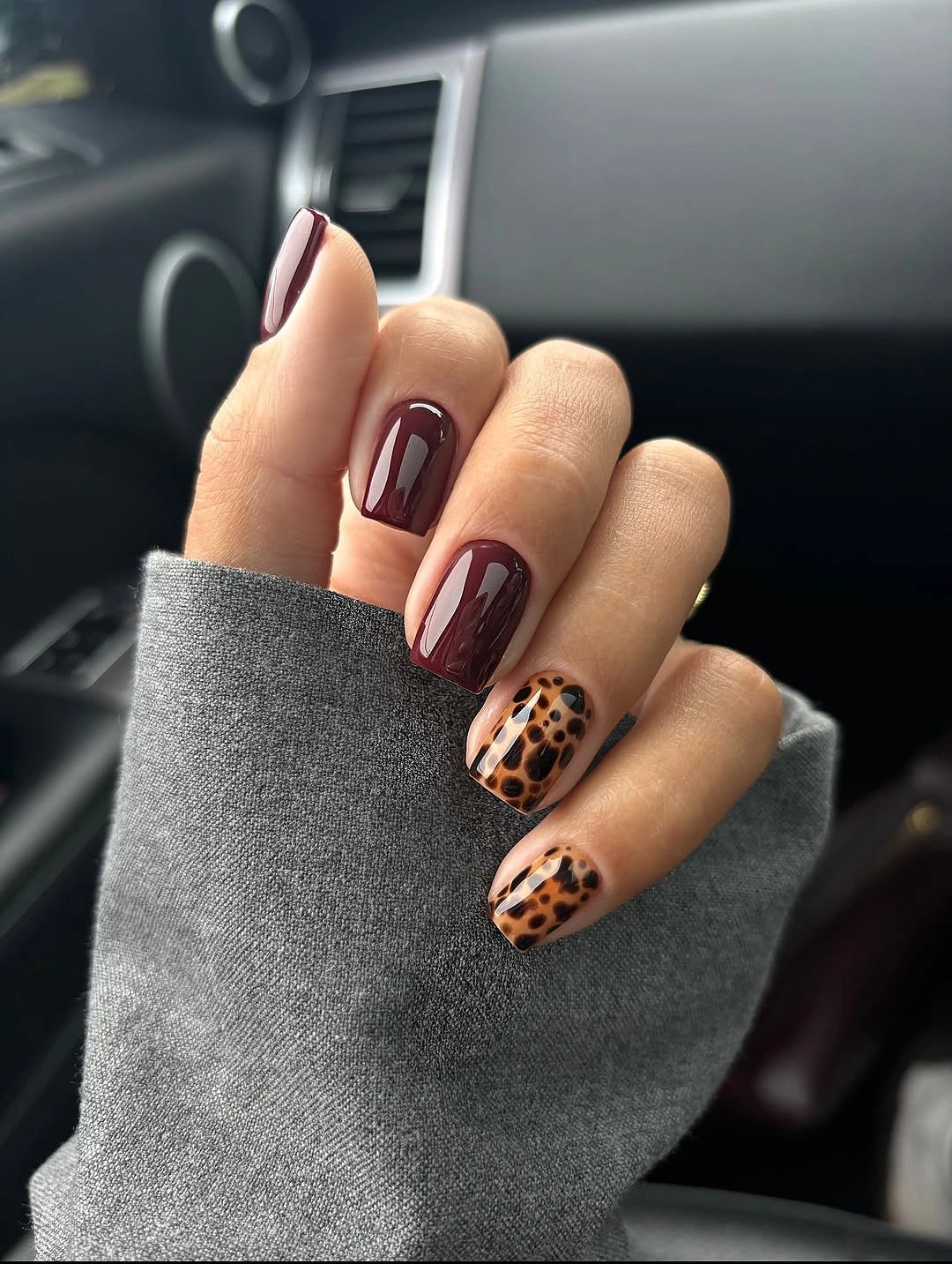 September Nail Art Ideas 2026 Glossy Burgundy and Leopard Print with Modern Edge
