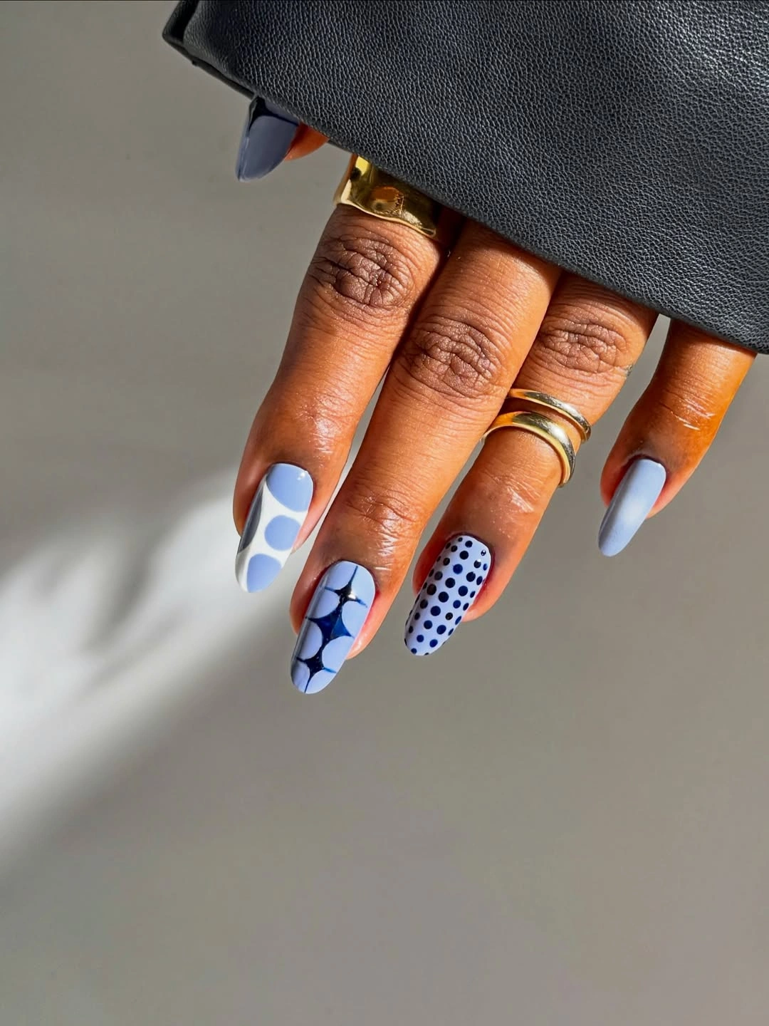 September nail designs 2026 Soft Blue Graphic Nails with a Contemporary Twist