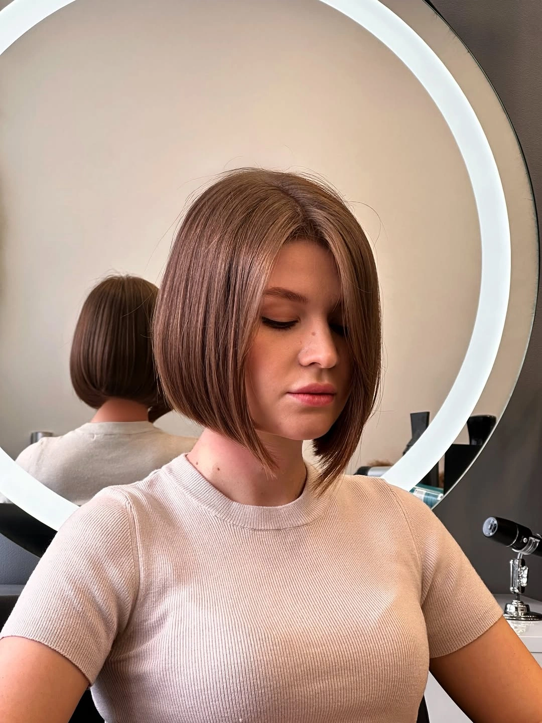 short bobbed hairstyle Classic Sleek Bob With Long Curtain Fringe