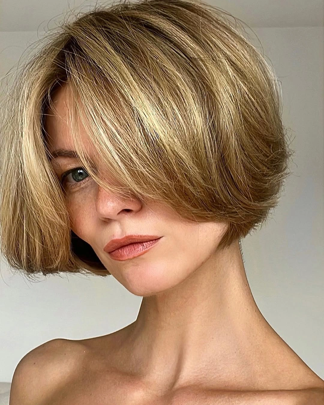 short bobbed hairstyle Soft Blonde Bob With Feathered Face-Framing Layers