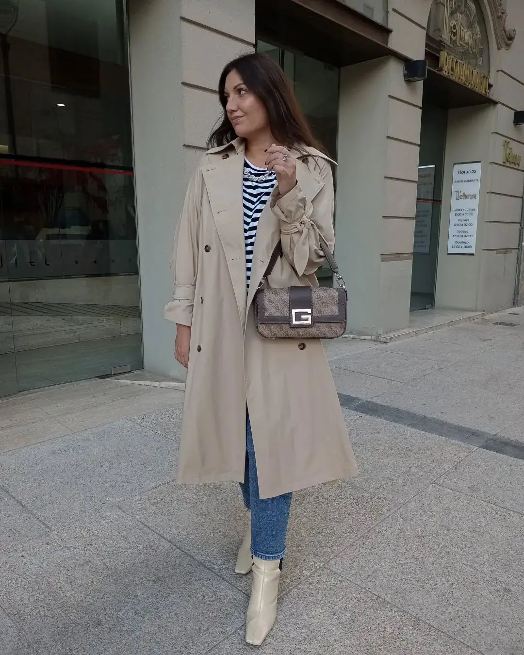 Trench coat fall outfits 2026 Parisian Stripes With Denim and Cream Boots