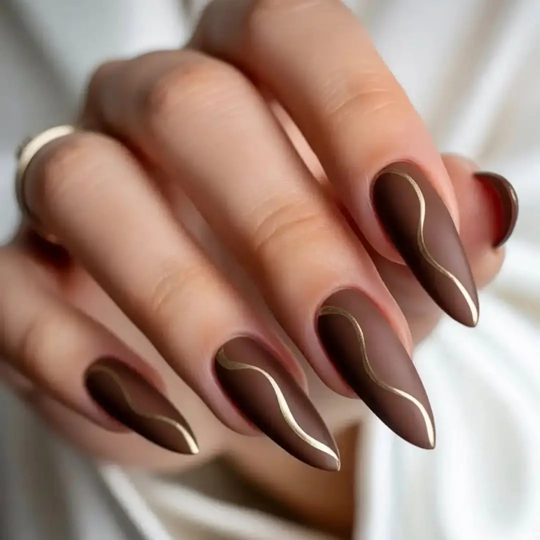 Brown Fall Nails 2026 Matte Mocha Almond Nails with Delicate Gold Waves