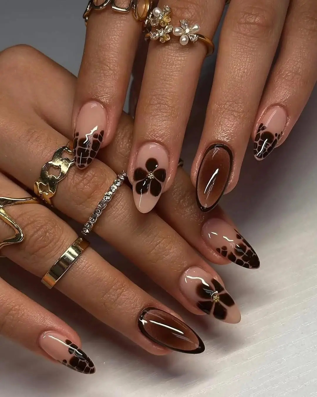 Brown Fall Nails 2026 Chocolate Floral Almond Nails with Elegant Tortoiseshell Details