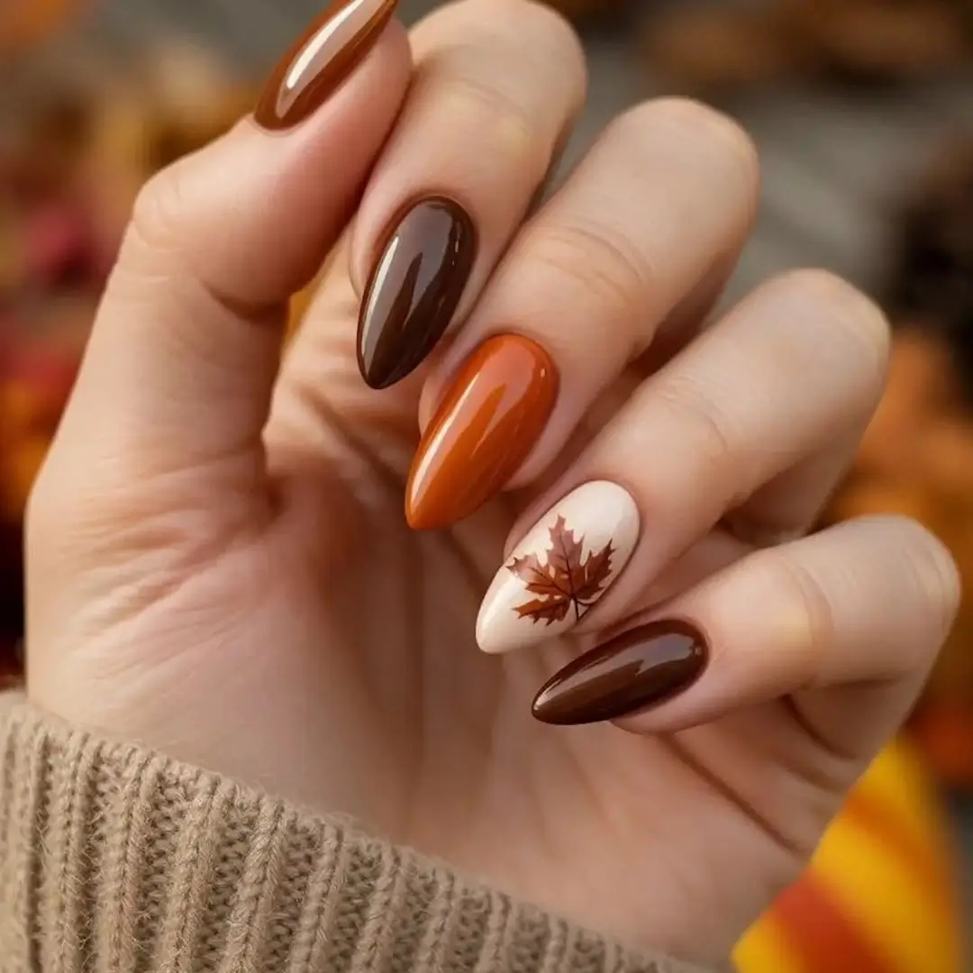 Dark fall nails 2026 Autumn Maple Leaf Nails in Warm Chocolate and Pumpkin Tones