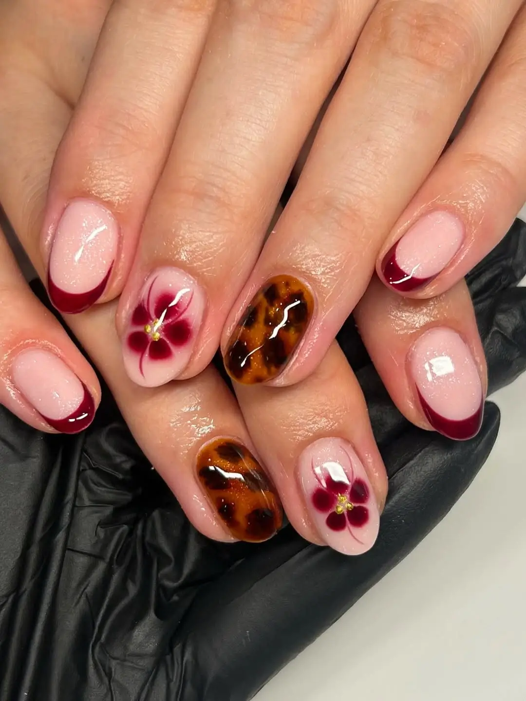 fall burgundy nails with design Burgundy French tips with tortoiseshell and floral details