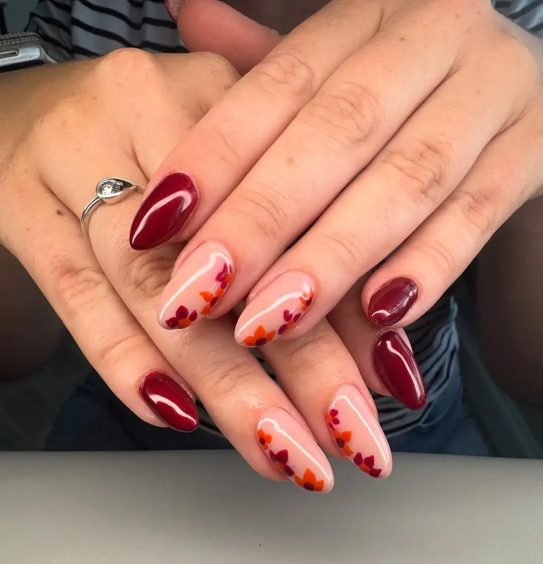 fall burgundy nails with design Burgundy almond nails with autumn leaf accents