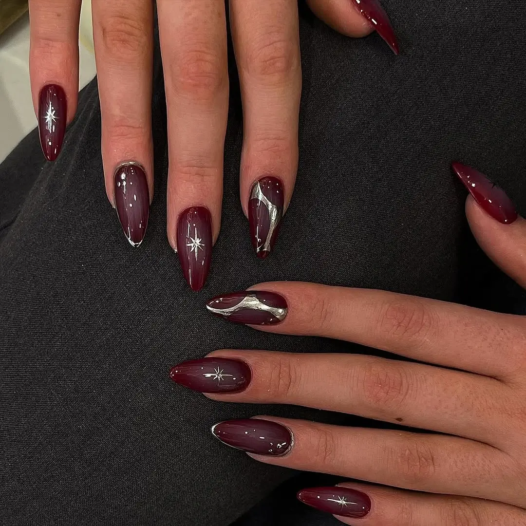 fall burgundy nails with design Deep burgundy nails with silver starburst details