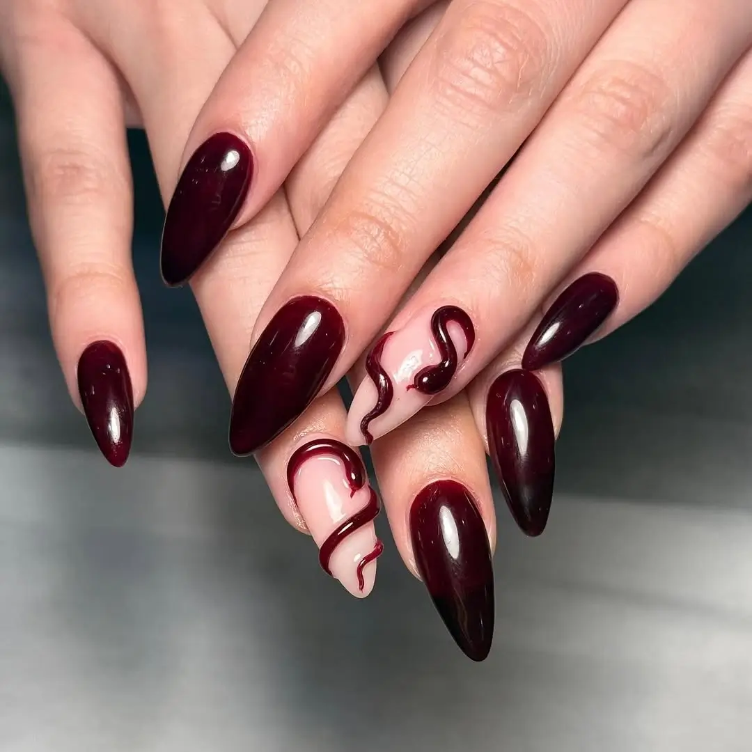 fall burgundy nails with design Glossy burgundy nails with sculptural accent lines