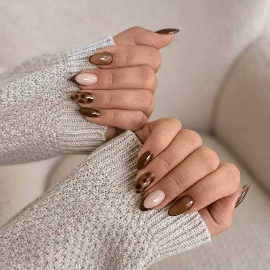Fall gel nails ideas 2026 Warm Mocha Nails With Subtle Leopard Accents