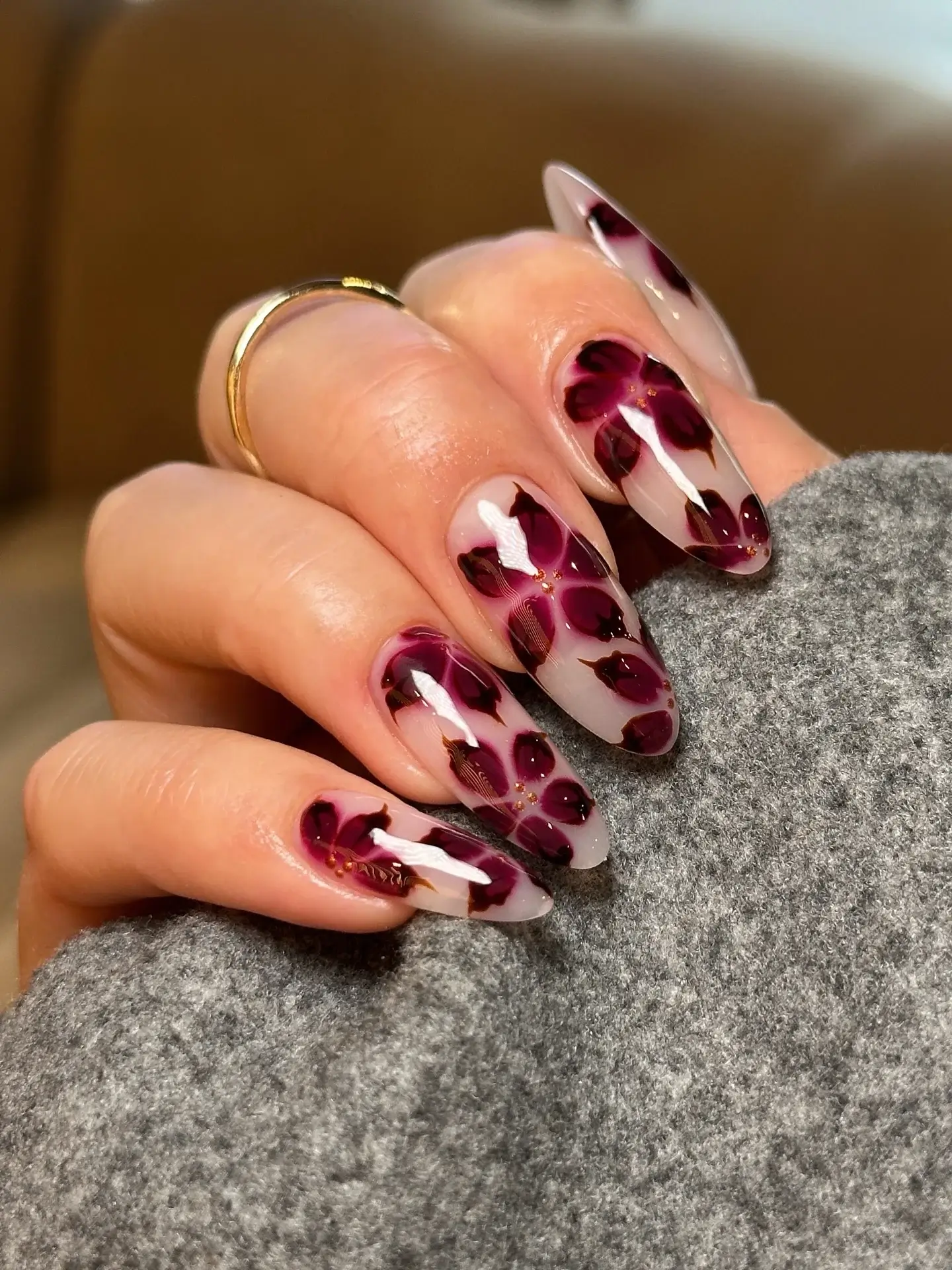 Fall manicure ideas 2026 Burgundy Floral Glass Nails for an Elegant Autumn Statement