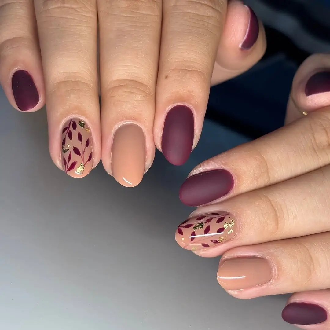 Fall manicure ideas 2026 Matte Burgundy Botanical Nails for Cozy Autumn Days