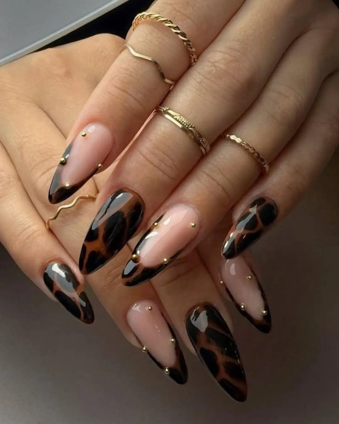 Fall Nail Inspiration 2026 Glossy Tortoiseshell Nails with Chic Gold Stud Details