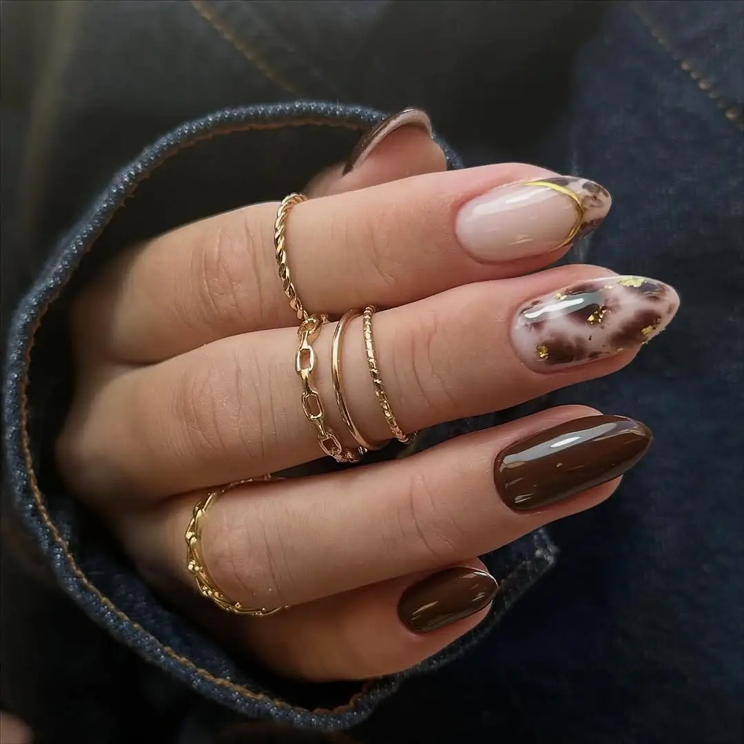 fall nail trends 2026 Chocolate Tortoiseshell Almond Nails with Gold Details