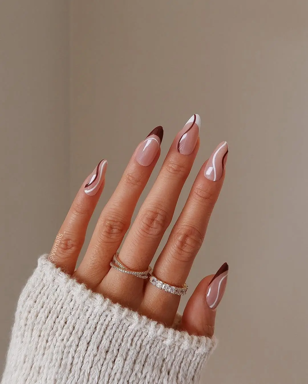 fall nail trends 2026 Elegant Chocolate and White Swirl French Tips