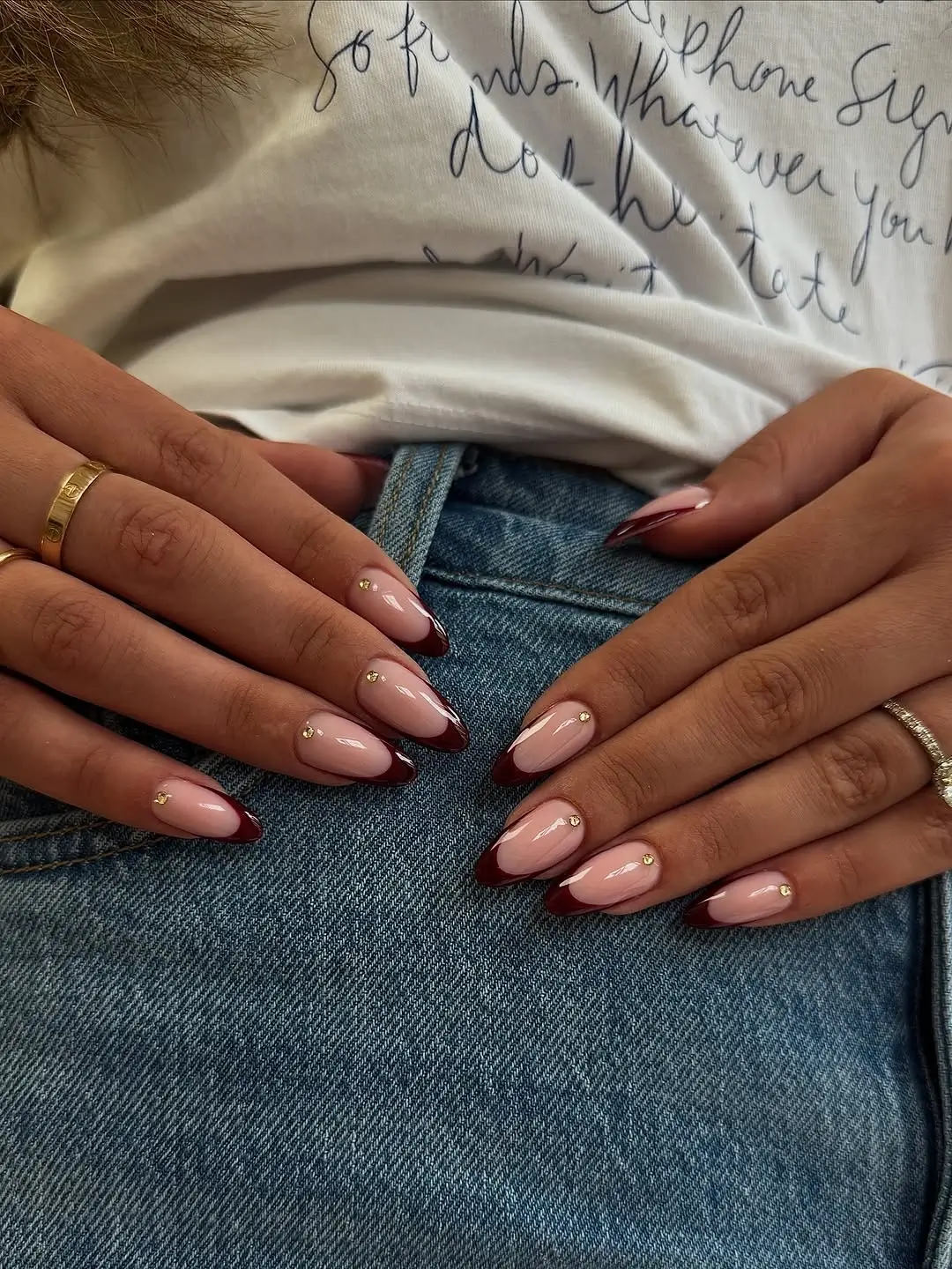 fall nail trends 2026 Burgundy French Almond Nails with Delicate Gold Accents