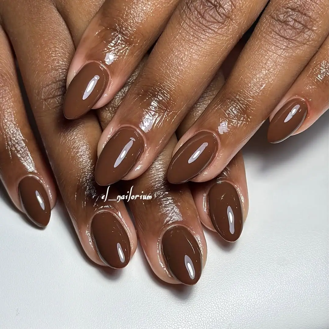 Fall nails colors for dark skin glossy chocolate brown almond manicure