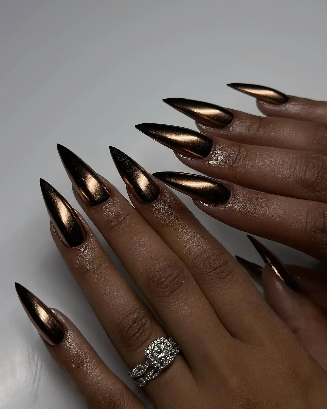 Fall nails colors for dark skin tone with bronze chrome stiletto nails