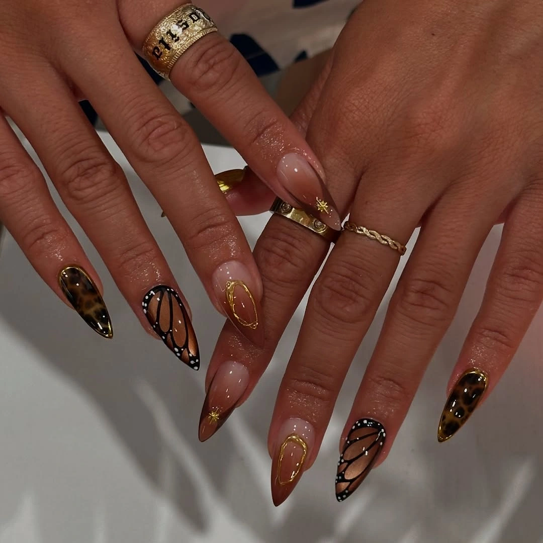 fall nails for brown skin tone Leopard Print And Gold Framing For A Playful Autumn Set