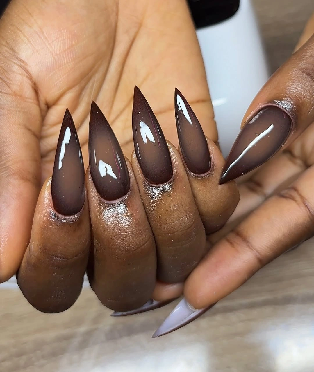 fall nails for brown skin tone Deep Chocolate Stiletto Nails With A Glossy Finish