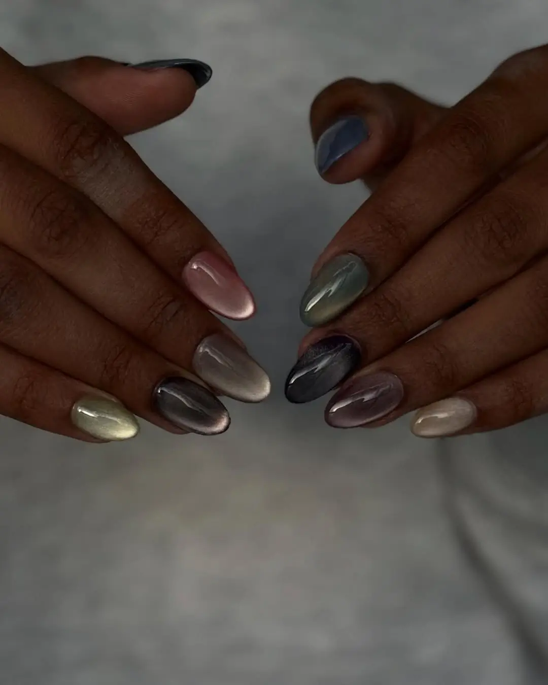 Fall nails for dark skin 2026 Muted Chrome Cat Eye Nails With a Modern Twist