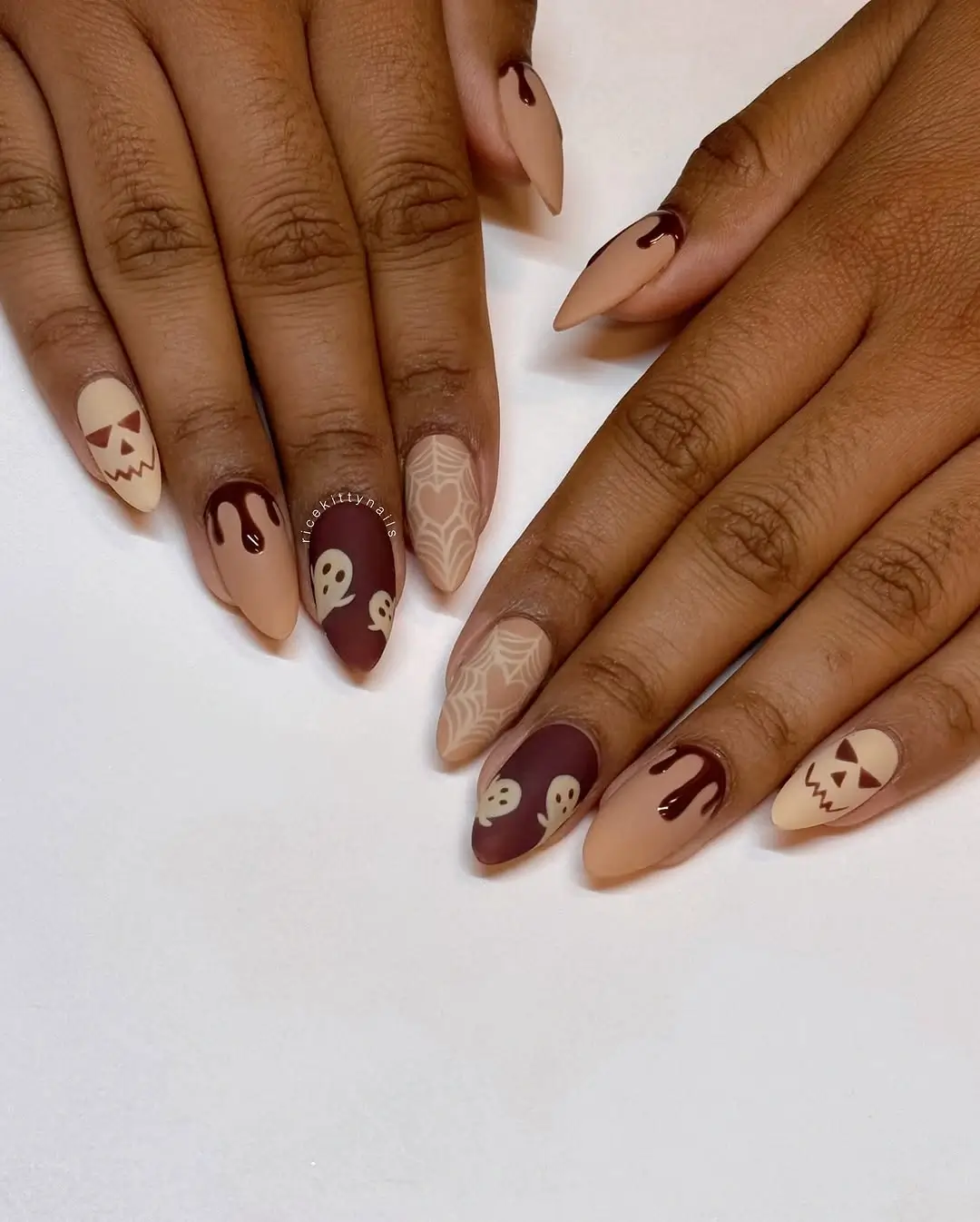 Fall nails for dark skin 2026 Playful Halloween Nails With a Chic Neutral Palette