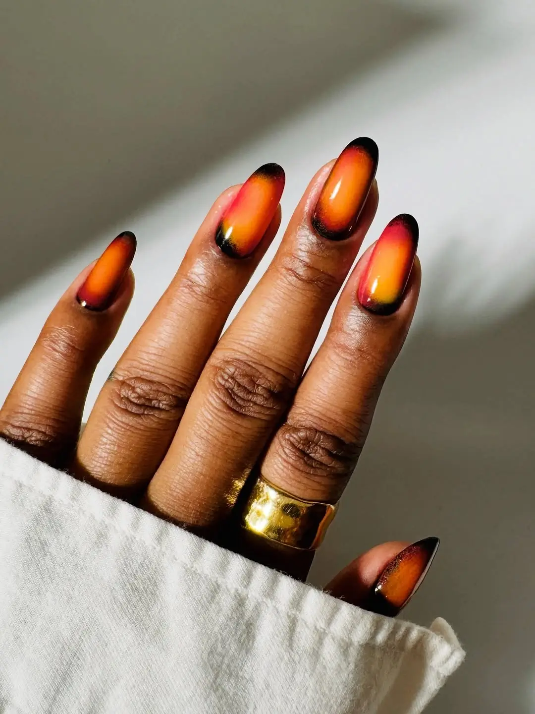 Fall nails for dark skin 2026 Sunset Ombre Nails That Glow Like an Autumn Evening