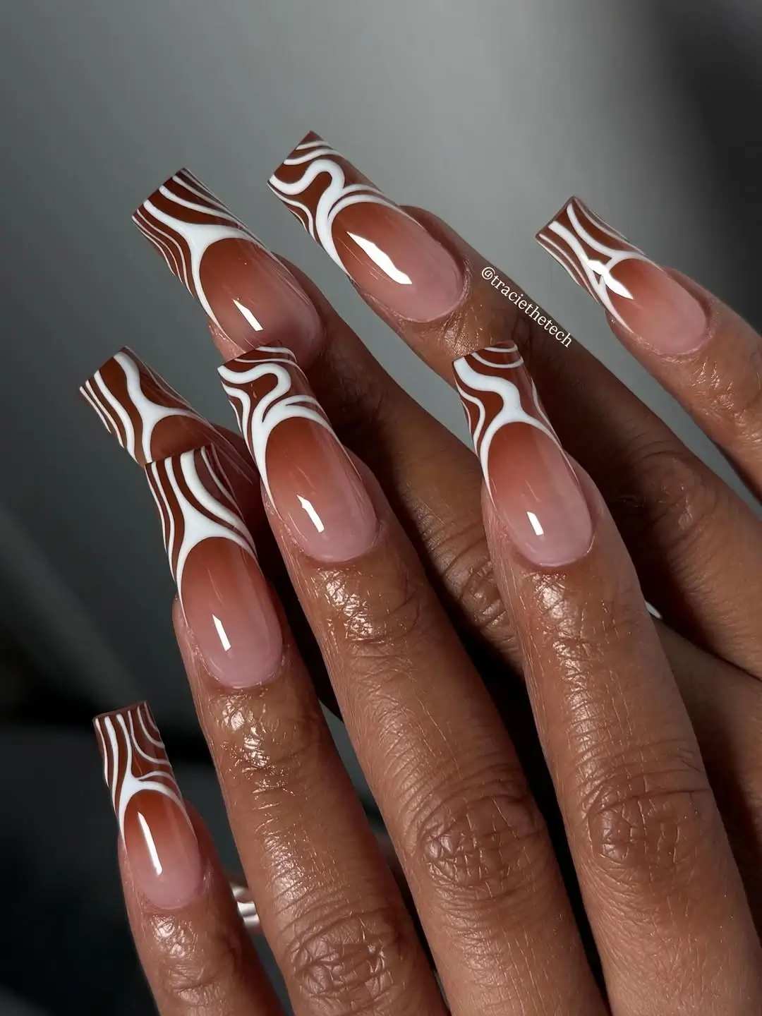 Fall nails for dark skin 2026 Abstract Chocolate Swirl French Tips for a Modern Fall Look
