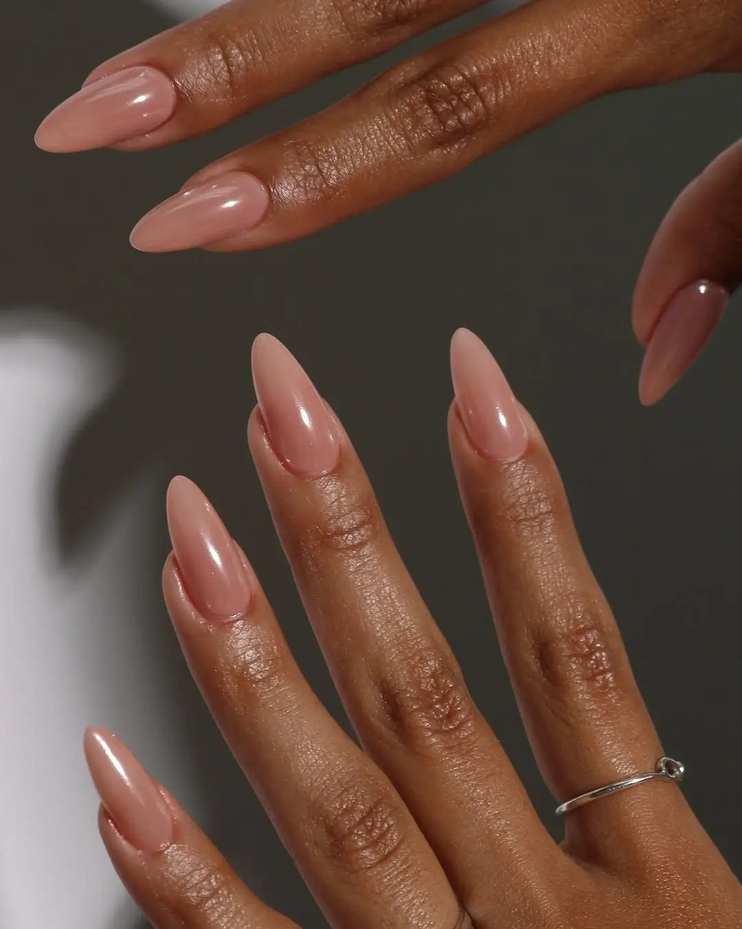 Fall nails for dark skin 2026 Glossy Nude Almond Nails That Never Go Out of Style