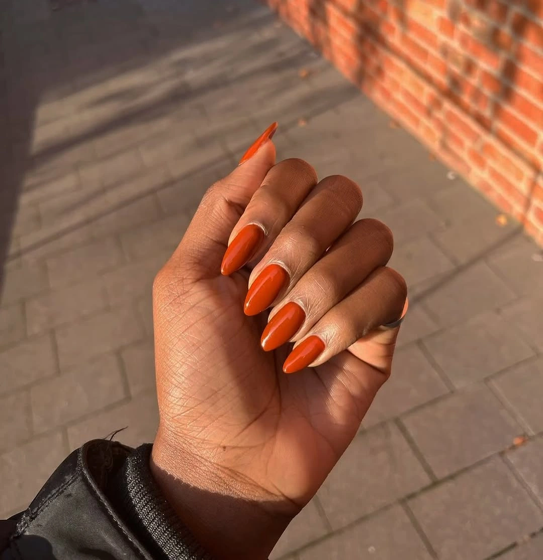 fall nails for tan skin tone bright burnt orange almond nails