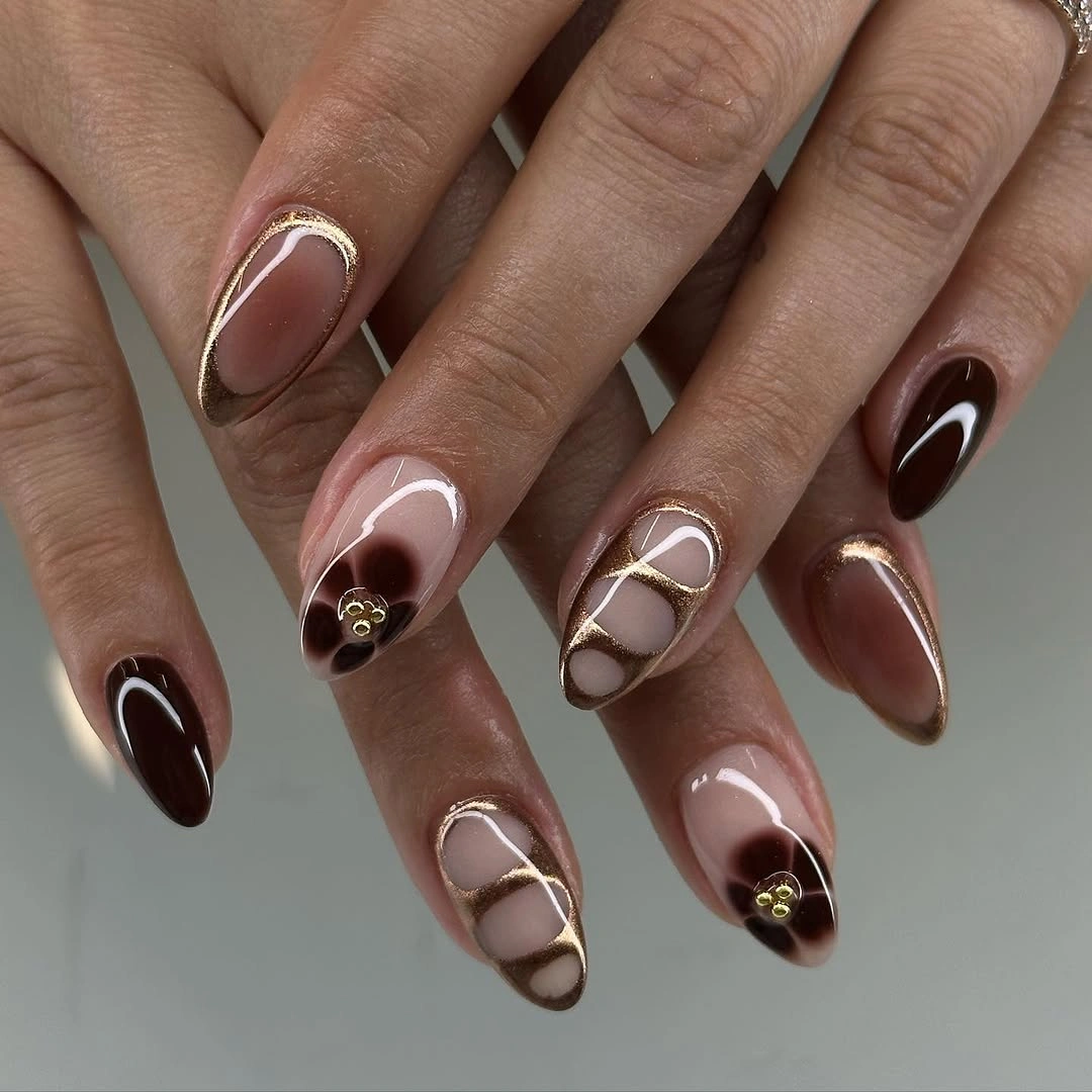 fall nails for tan skin tone chocolate and gold ribbon design