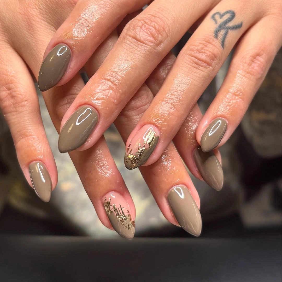 fall nails for tan skin tone taupe almond nails with gold flakes