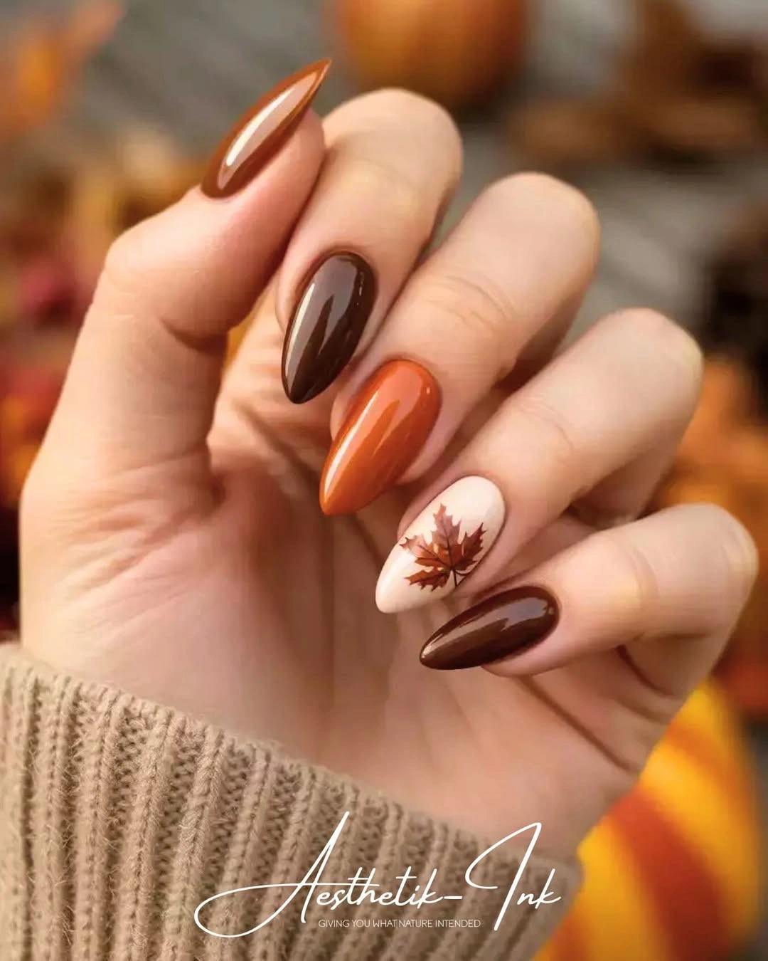 fall trendy nails 2026 brown orange almond nails with autumn leaf art