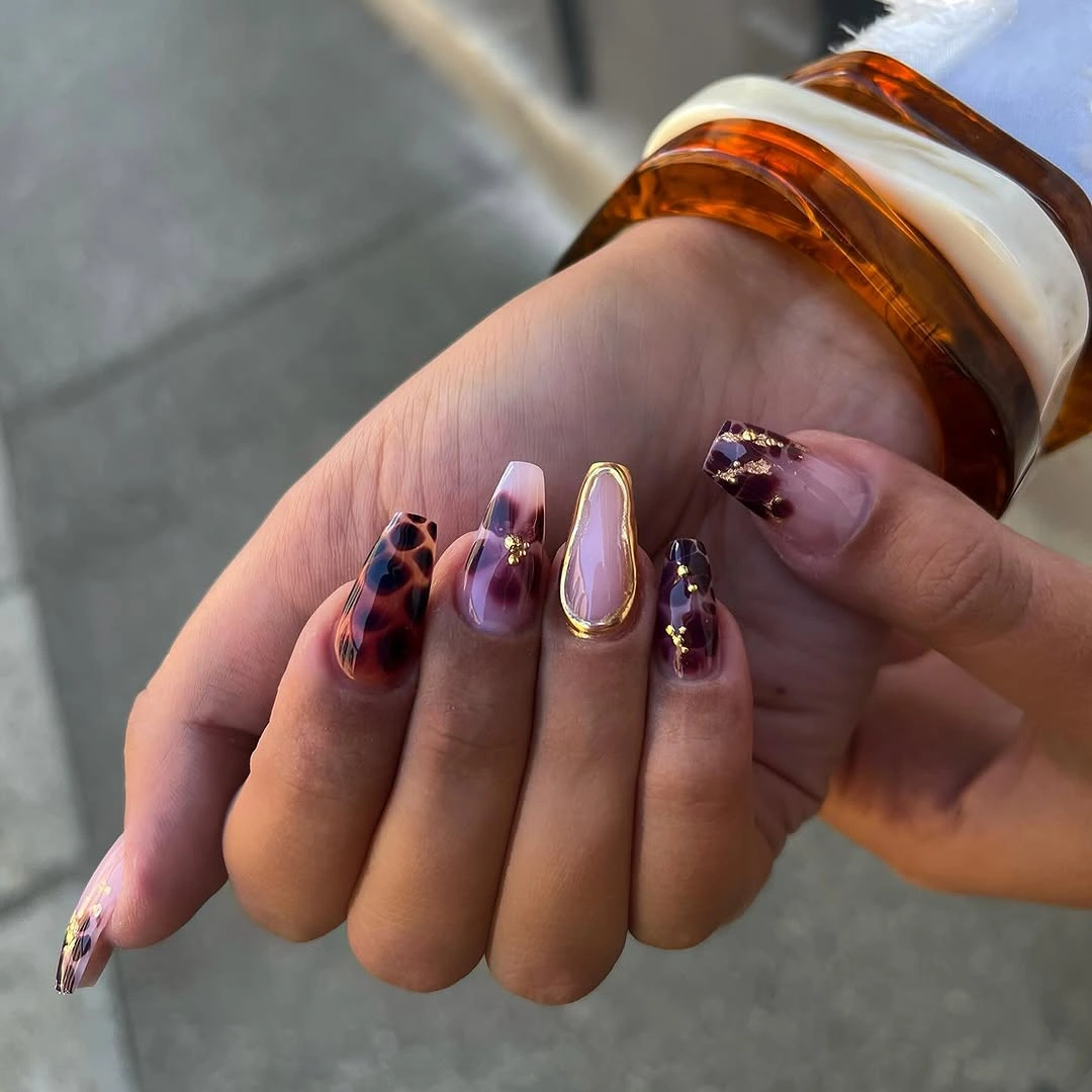 fall trendy nails 2026 plum leopard manicure with gold accents